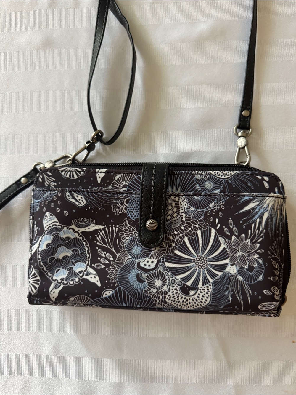 Sakroots Crossbody Wallet with midnight seascape pattern